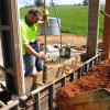 Riverina Rammed Earth Construction owner Anthony Wright getting his hands dirty