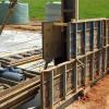Add new lift of rammed earth formwork after completing lift one