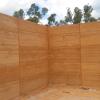 A finished rammed earth corner section